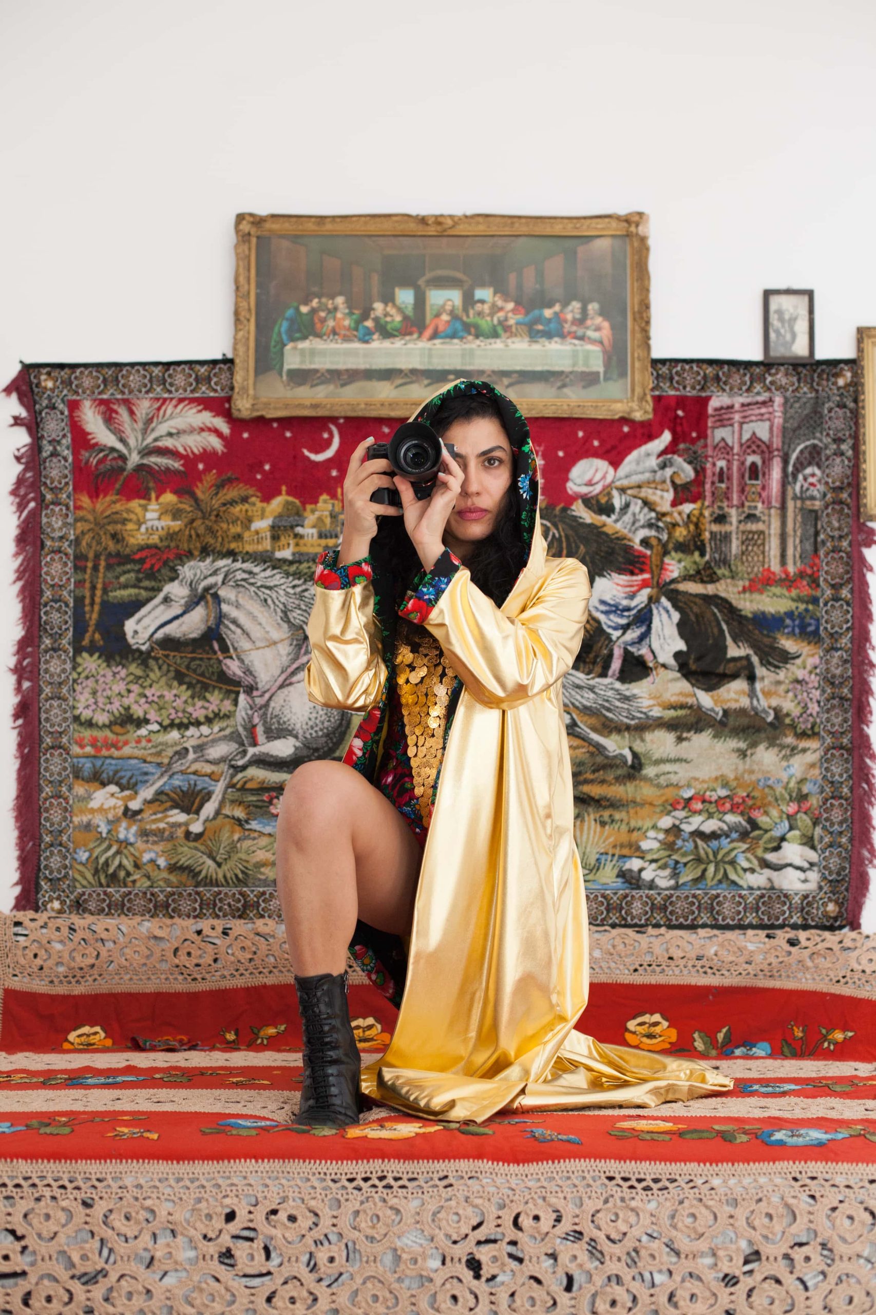 Multidisciplinary artist Mihaela Drăgan next to „The Abduction from the Seraglio”, installation work by artist Eugen Raportoru, 2022, courtesy of Ilina Schileru