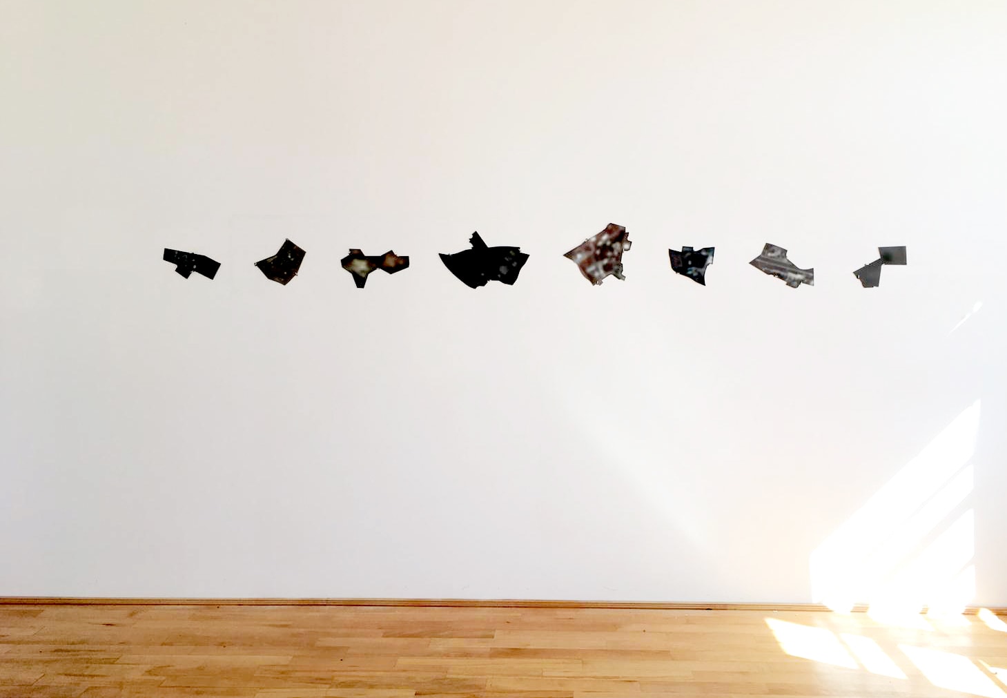 Baran Caginli, Untitle, 8 laser cut photographic prints on  aluminum, 2020. Installation view. © Florin Bobu